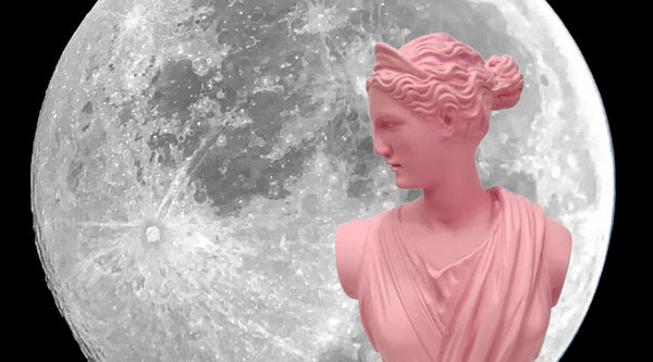 goddess artemis bust in front of the moon