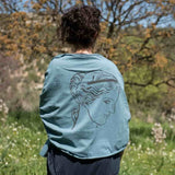 Aphrodite of Milos shawl in Blue color with model in nature landscape