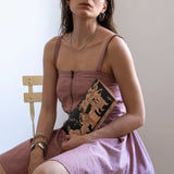 The abduction of the daughters of Leucippus λεατηερ clutch - envelope bag (Medium) with model