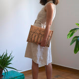 Woman Holding Portfolio Large Golden Ratio Goat Leather Black Silkscreen