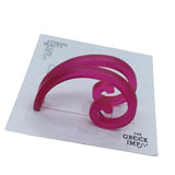 a pair of Fibonacci - Golden Ratio Spiral Earings Fuchisa color