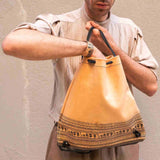 male model with geometric period goat leather backpack (drawstring) front - Mythology clothing and accessories for mythical style with quality in mind. Dark academia aesthetic bags and accessories be part of the myth
