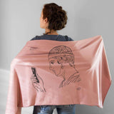 Charioteer statue depicted in a modern Greek shawl - pink color with model
