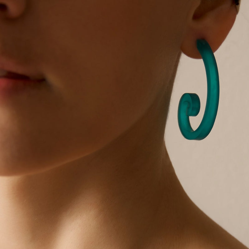a pair of Golden Ratio Spiral Earings turquoise color
